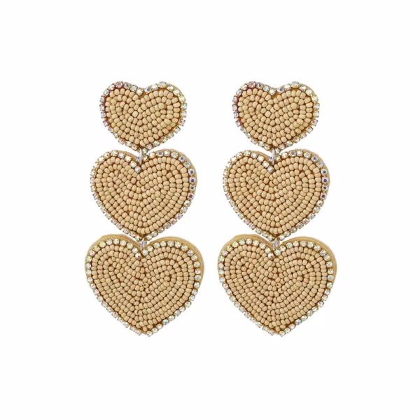Grote kralen statement oorbellen met drie beige harten
