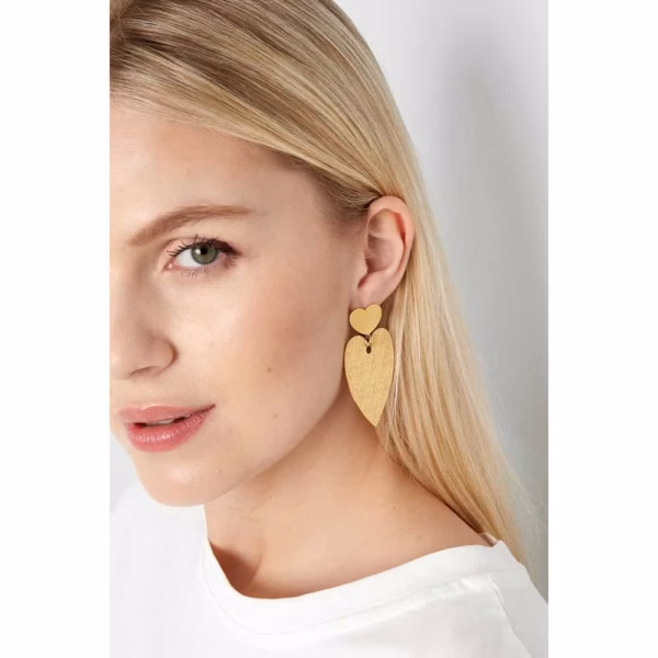 Gold statement earrings with heart