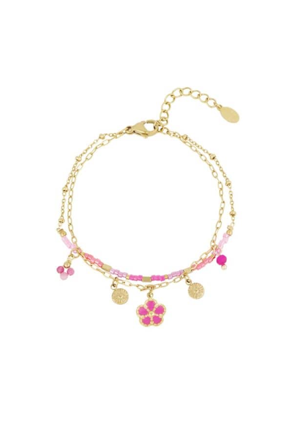 Dubbel armbandje gold plated met roze kraaltjes en bedeltjes